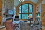 Spacious Living Area with vaulted ceilings and a view of the river